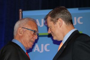 Gov. Baker (r) congratulates Arthur Winn (l) on the AJC award