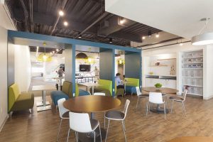 The game room features a variety of seating options as well as a ping pong table, foosball tables and video-gaming area.  