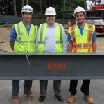 (l to r)BOND Superintendent Nick Anastasi, BOND Senior Project Manager Dan Ramos, and BOND Project Engineer Dan Dwan behind the final steel beam.