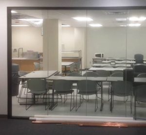 Image of classroom glass panels before window film installation, RI Nurses Institute Middle College, Providence 