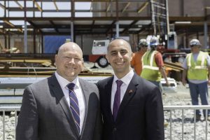 Ron Simoneau, Vice President of Shawmut Design and Construction, stands with Providence Mayor Jorge Elorza during a topping off ceremony for the Shawmut-built Brown University School of Engineering building, located at 345 Brook Street in Providence, RI. 
