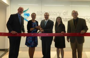 (l- r) Co-Chair of the Advisory Council for the Harvard Program in Therapeutic Science Joshua Boger; President & CEO of the Massachusetts Life Sciences Susan Windham-Bannister; Dean of Harvard Medical School Jeffrey Flier; Executive Director of the Harvard Program in Therapeutic Science Laura Maliszewski, and Director of the Laboratory of Systems Pharmacology Peter Sorger celebrate the opening of Harvard Medical School’s new Laboratory for Systems Pharmacology.