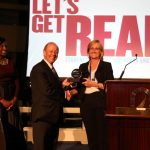 Holbrook accepts award