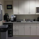Before: This kitchen was a small, drab, uninviting room, with no place to sit.  Employees used the room only to store or prepare their food. 