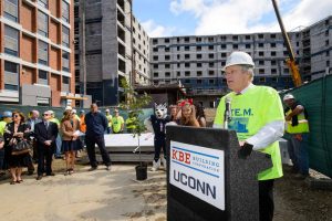 Simon Etzel, senior vice president and & principal of KBE Builders speaks during the topping off ceremony for the STEM residence hall on Sept. 14, 2015. (Peter Morenus/UConn Photo)