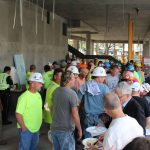 Members of the design/build team mingle with Lesley University staff at the topping off ceremony.