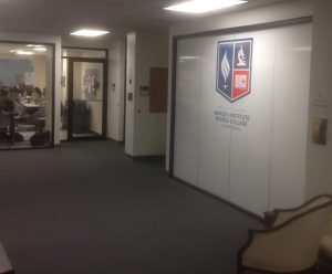 Rhode Island Nurses Institute Middle College installation of logo, opaque white 3M™ Scotchcal™ Electrocut Film and 3M™ Scotchshield™ Safety & Security Film on classroom glass walls panels. /courtesy Rhode Island Nurses Institute Middle College, Providence, RI 