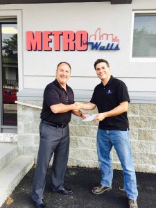 Mike Dion presents a $2,500 check to Ken Lambert, EDI employee and founder of Keep Sound Minds.