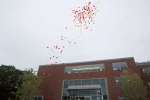 Balloons flying out over Regis Library