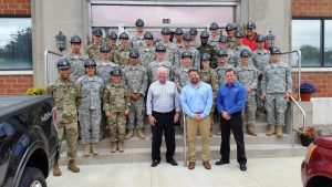 Ken Corneau, president and CEO of United Steel, Kyle Corneau, vice president of United Metal Solutions, and Keith Corneau, executive vice president of United Steel with Cadets