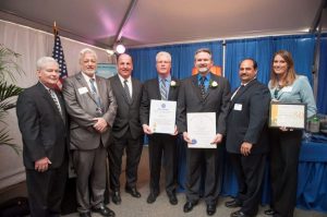(l-r) Avon Board of Selectman Chairman Frank Hegarty, Avon Selectman Robert Brady, State Senator Brian Joyce, Weiss Sheet Metal owners Brian DeLano and Wayne DeLano, Bob Costa, President of the Avon Industrial Park Association, and Alison Van Dam, Vice –President, Metro South Chamber of Commerce. Weiss Sheet Metal received proclamations from the Massachusetts House of Representatives, Massachusetts State Senate, and the Metro South Chamber of Commerce