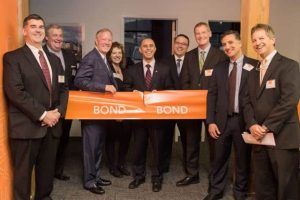(l-r) Bond representatives: Frank Hayes, Chief Operating Officer; Bo Koloski, Director of Client Services; Edward A. Bond, Jr., Chief Executive Officer; Kim Silvestri, Project Executive; Jorge O. Elorza, Mayor of Providence, RI; Dan Ramos, Regional Manager; Thomas Baillie, Senior Vice President, Civil & Utility Division; David Shrestinian, Senior Vice President, Building Division; Robert Murray, President.