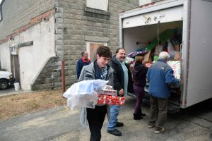 Lynn Robatham and team delivering toys to Torrington Youth Service Bureau