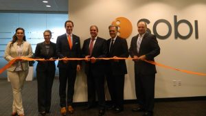 (l to r) Brittany McDonough, Manager of Business Development for the Massachusetts Office of International Trade & Investment; Susan Windham-Bannister, Ph.D, President & CEO of the Massachusetts Life Sciences Center; Dr. Geoffey McDonough, Chief Executive Officer of Sobi; Rami Levin, President of Sobi, Inc. North America; Dr. Peter Saltonstall, President of the National Organization of Rare Disorders; and Peter Abair, Director of Economic Development & Global Affairs for MassBio celebrate the opening of Sobi’s new North America Headquarters in Waltham, Massachusetts.